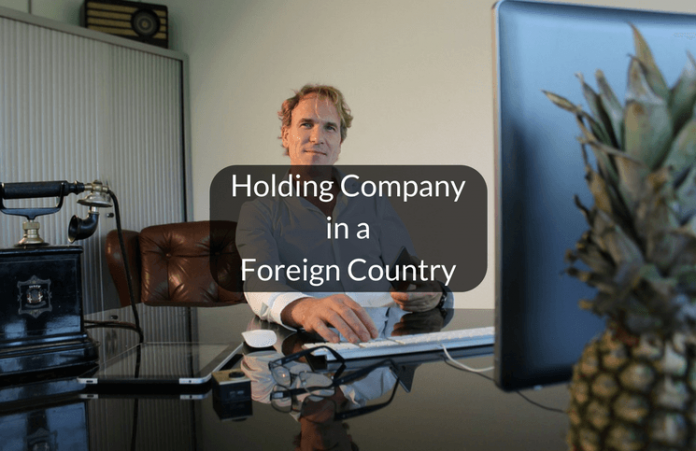 Incorporation of holding company in another country