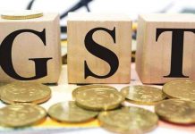 How is the GST regime promoting socio-economic development in India